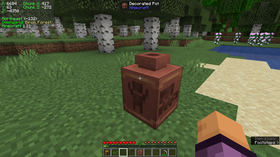 Minecraft decorated pot in a birch forest showing the pot's patterned sides