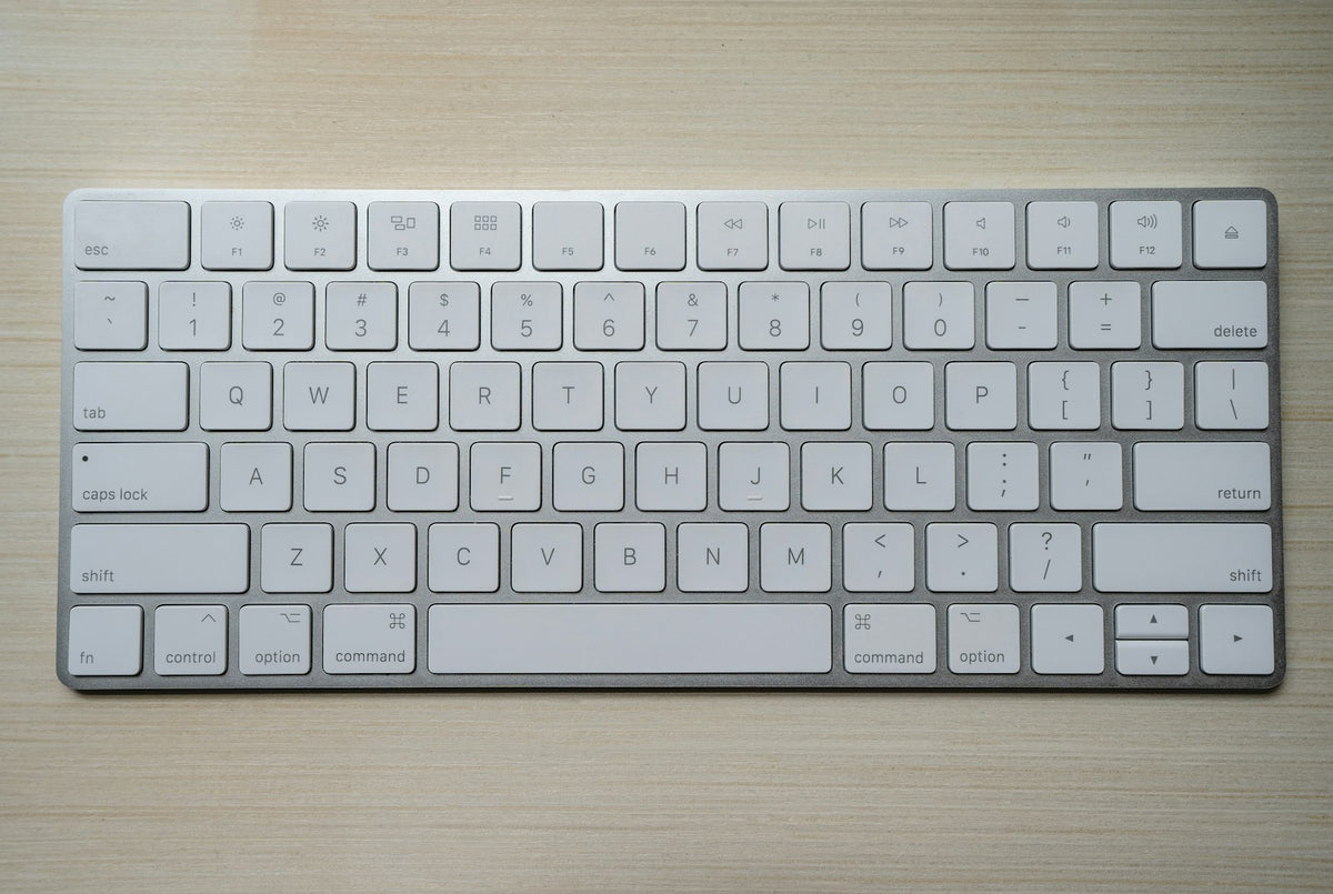 Close-up of a physical keyboard representing Minecraft mobile chat input