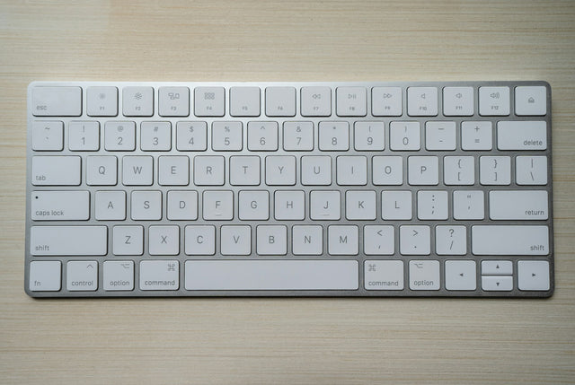 Close-up of a physical keyboard representing Minecraft mobile chat input